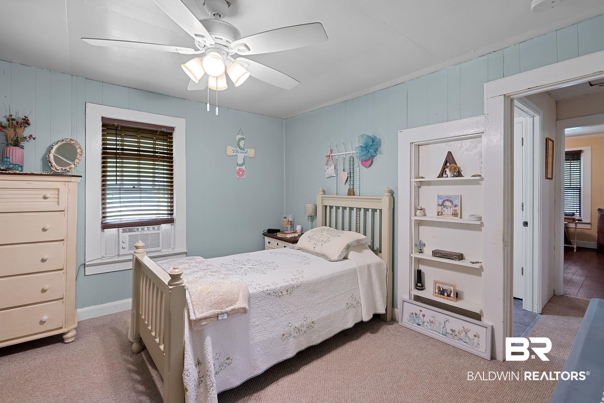 615 West Section Avenue Foley, AL 36535 - Photo 16 of 40 Carpeted room featuring light blue vertical paneling and white trim