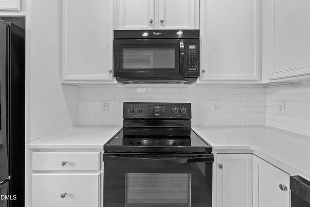 a spacious bathroom with a granite countertop sink and a mirror