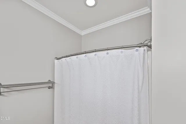 a living room with furniture and a lamp