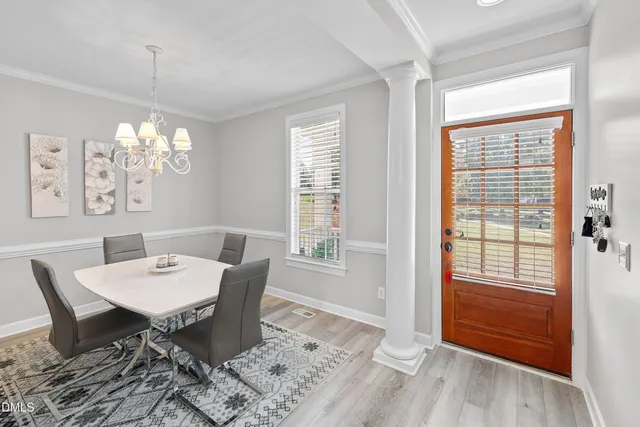 a view of entryway with wooden floor and stairs