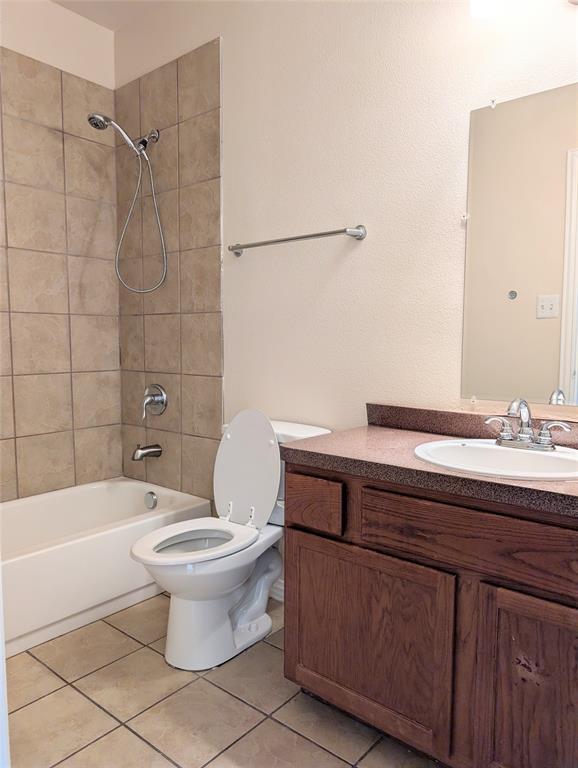 1223 Georgia Avenue Dallas, TX 75216 - Photo 11 of 13 a bathroom with a sink a toilet and shower