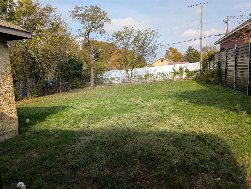 1223 Georgia Avenue Dallas, TX 75216 - Photo 12 of 13 a view of a field with a tree