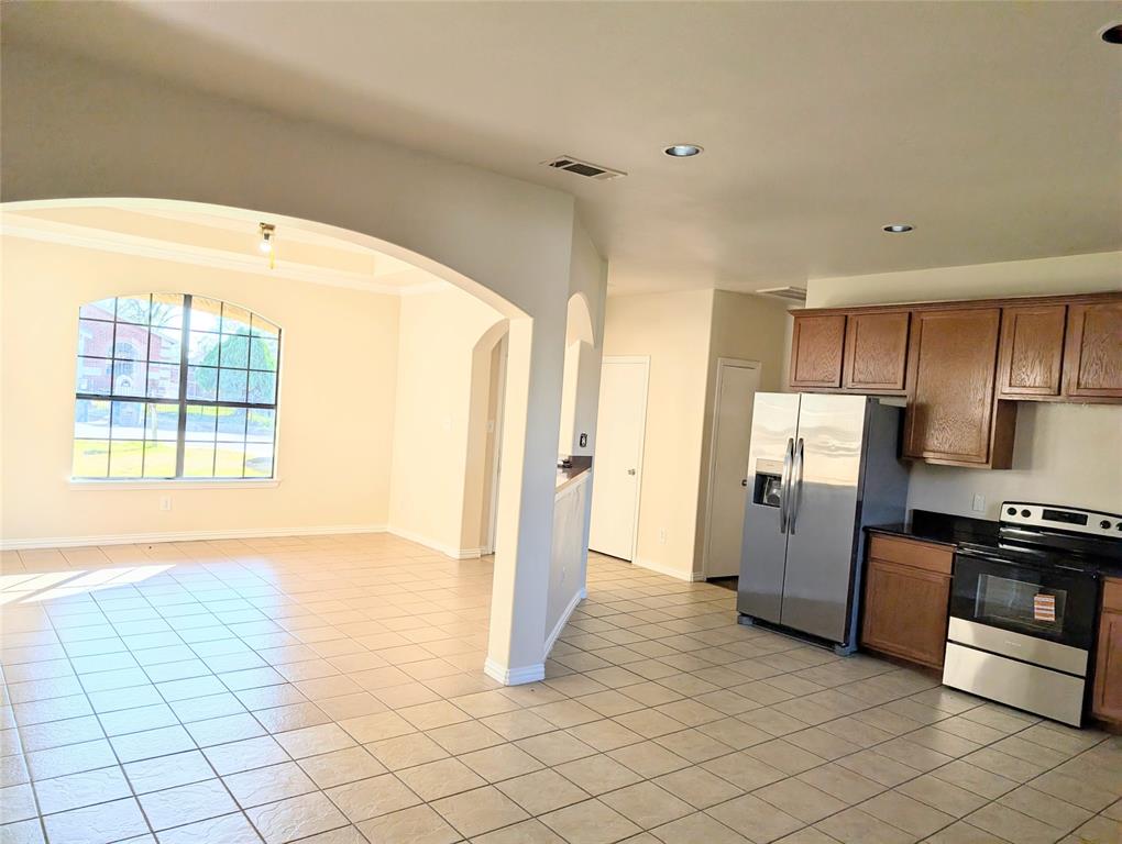 1223 Georgia Avenue Dallas, TX 75216 - Photo 13 of 13 a view of a kitchen with a sink and a refrigerator