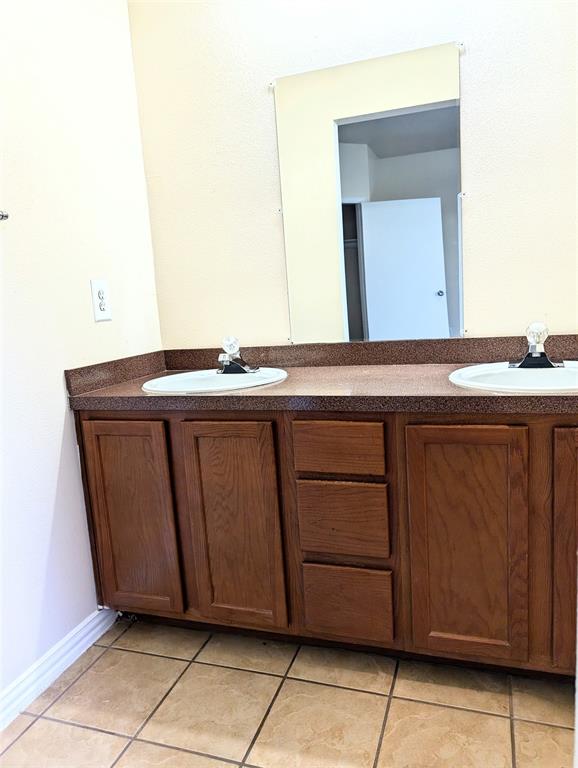1223 Georgia Avenue Dallas, TX 75216 - Photo 8 of 13 a bathroom with a sink and a mirror