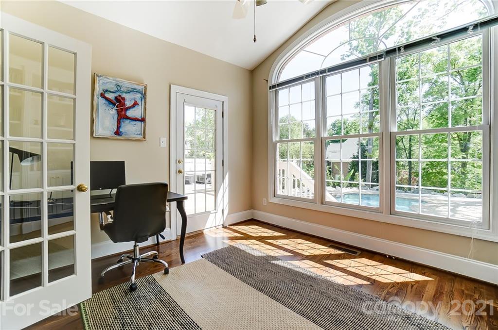 7126 Topsail Circle Tega Cay, SC 29708 - Photo 12 of 48 a living room with furniture and a floor to ceiling window