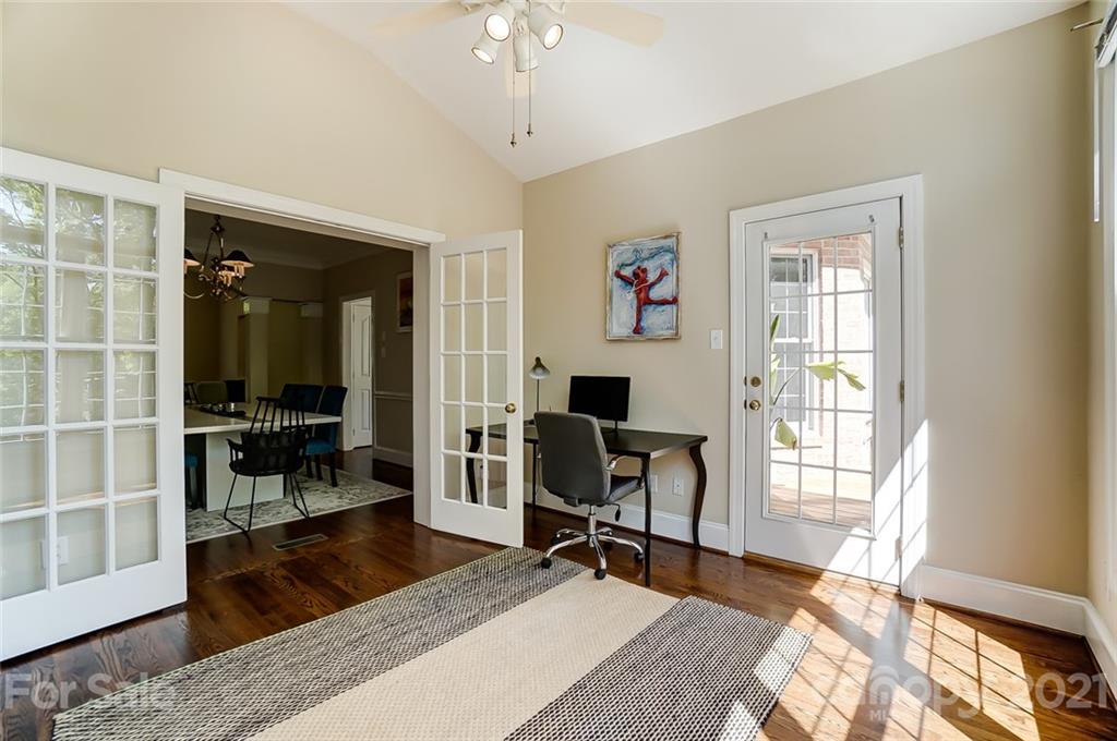 7126 Topsail Circle Tega Cay, SC 29708 - Photo 13 of 48 a living room with furniture a piano and a floor to ceiling window