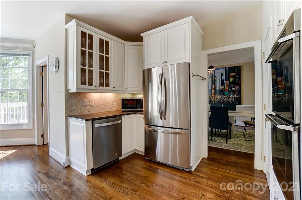 7126 Topsail Circle Tega Cay, SC 29708 - Photo 14 of 48 a kitchen with stainless steel appliances granite countertop a refrigerator and a stove top oven