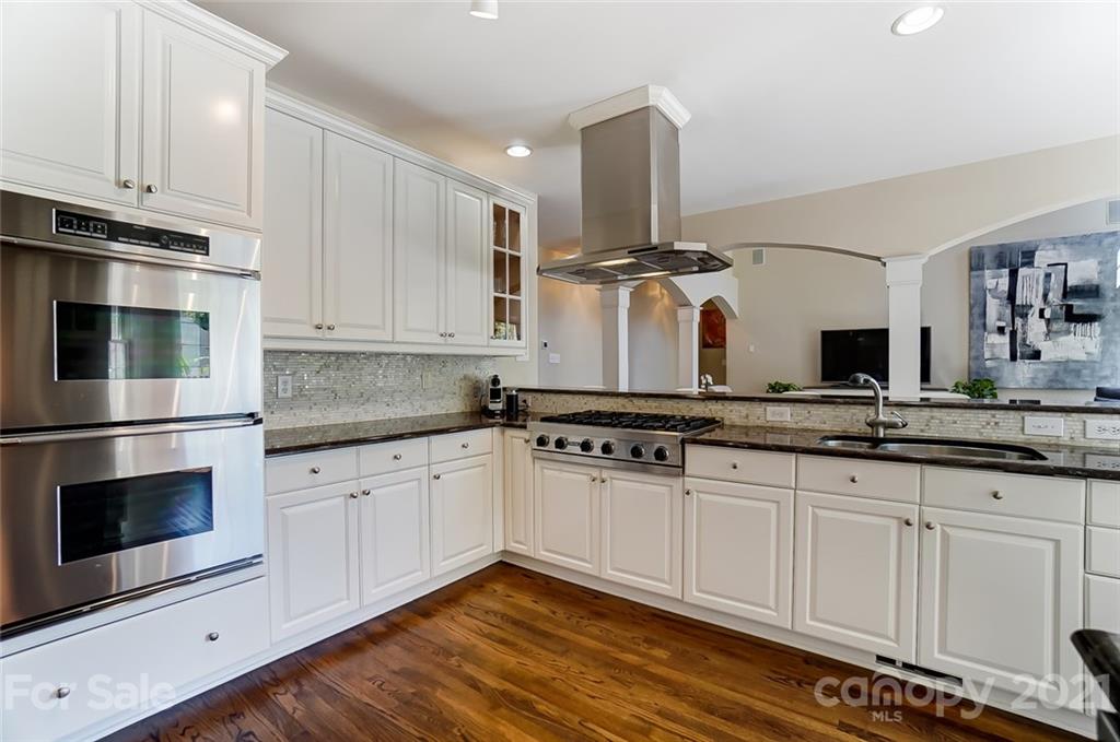 7126 Topsail Circle Tega Cay, SC 29708 - Photo 15 of 48 a kitchen with stainless steel appliances granite countertop a stove and a sink