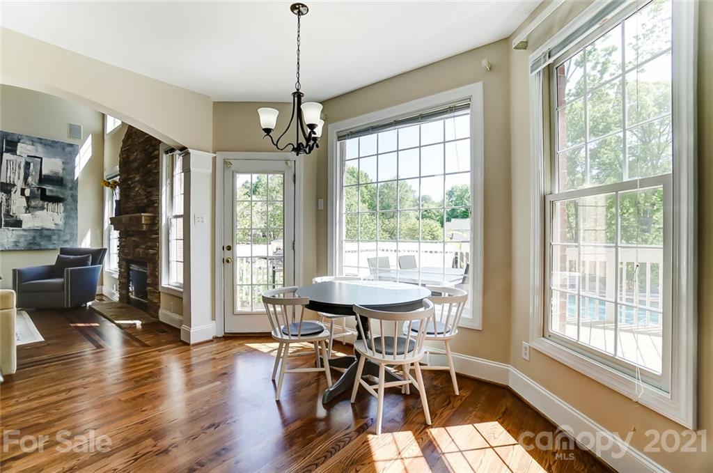7126 Topsail Circle Tega Cay, SC 29708 - Photo 19 of 48 a view of a dining room with furniture window and wooden floor