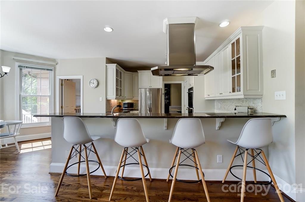 7126 Topsail Circle Tega Cay, SC 29708 - Photo 20 of 48 a view of kitchen with furniture and wooden floor
