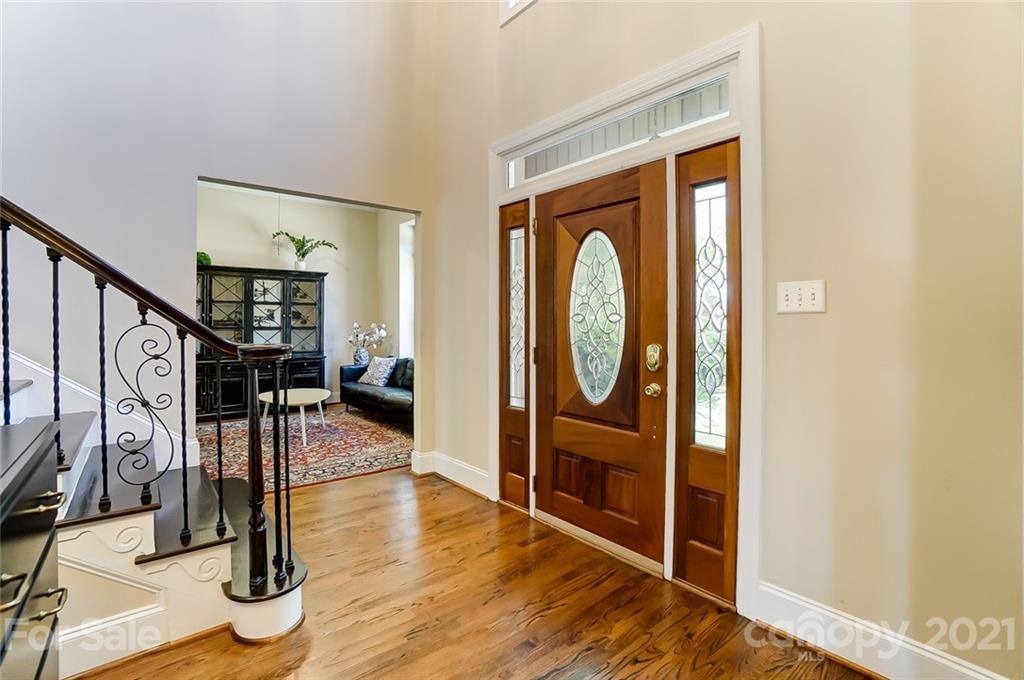 7126 Topsail Circle Tega Cay, SC 29708 - Photo 3 of 48 a view of a livingroom with wooden floor and furniture