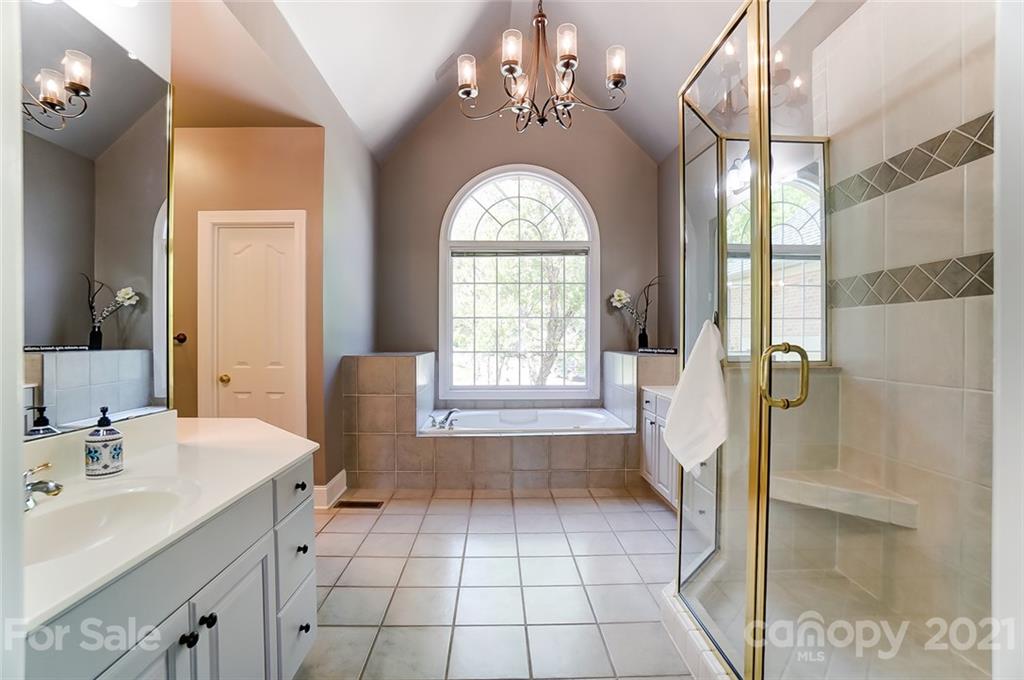 7126 Topsail Circle Tega Cay, SC 29708 - Photo 26 of 48 a bathroom with a sink a vanity and a mirror