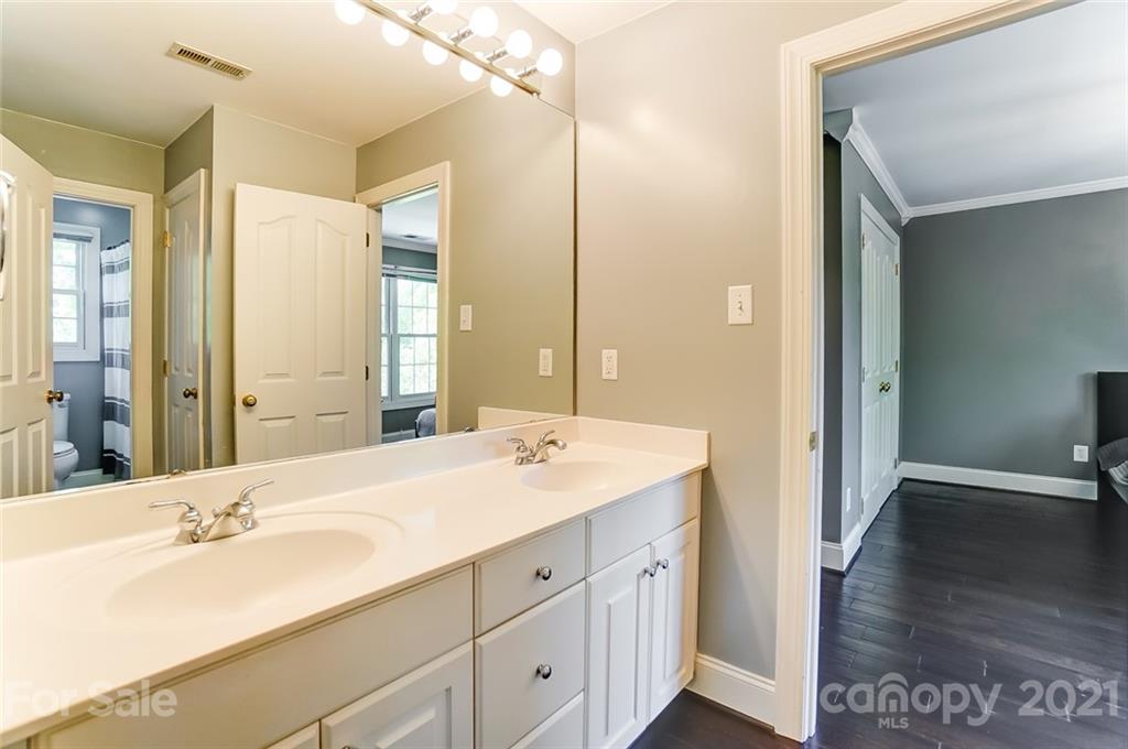 7126 Topsail Circle Tega Cay, SC 29708 - Photo 33 of 48 a bathroom with a sink double vanity and a mirror