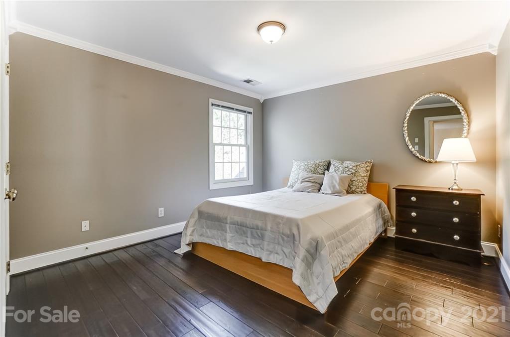 7126 Topsail Circle Tega Cay, SC 29708 - Photo 36 of 48 a bedroom with a bed and a dresser