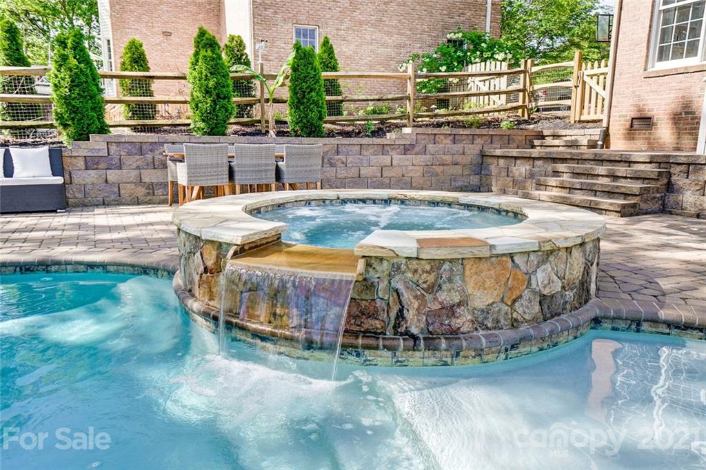 7126 Topsail Circle Tega Cay, SC 29708 - Photo 45 of 48 a view of a swimming pool with a patio