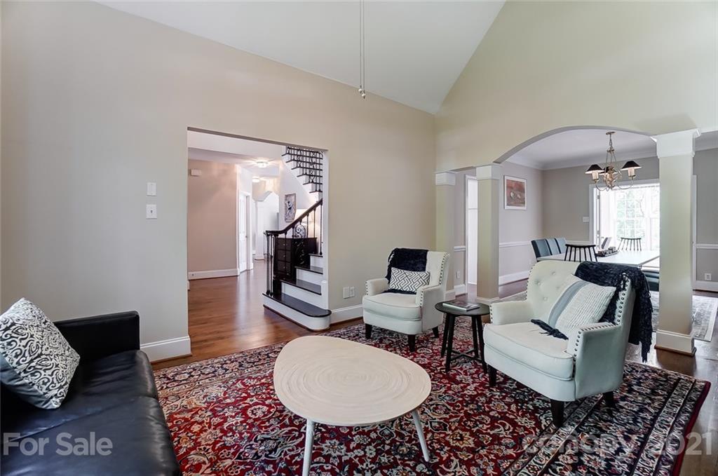 7126 Topsail Circle Tega Cay, SC 29708 - Photo 6 of 48 a living room with furniture a rug and a wooden floor