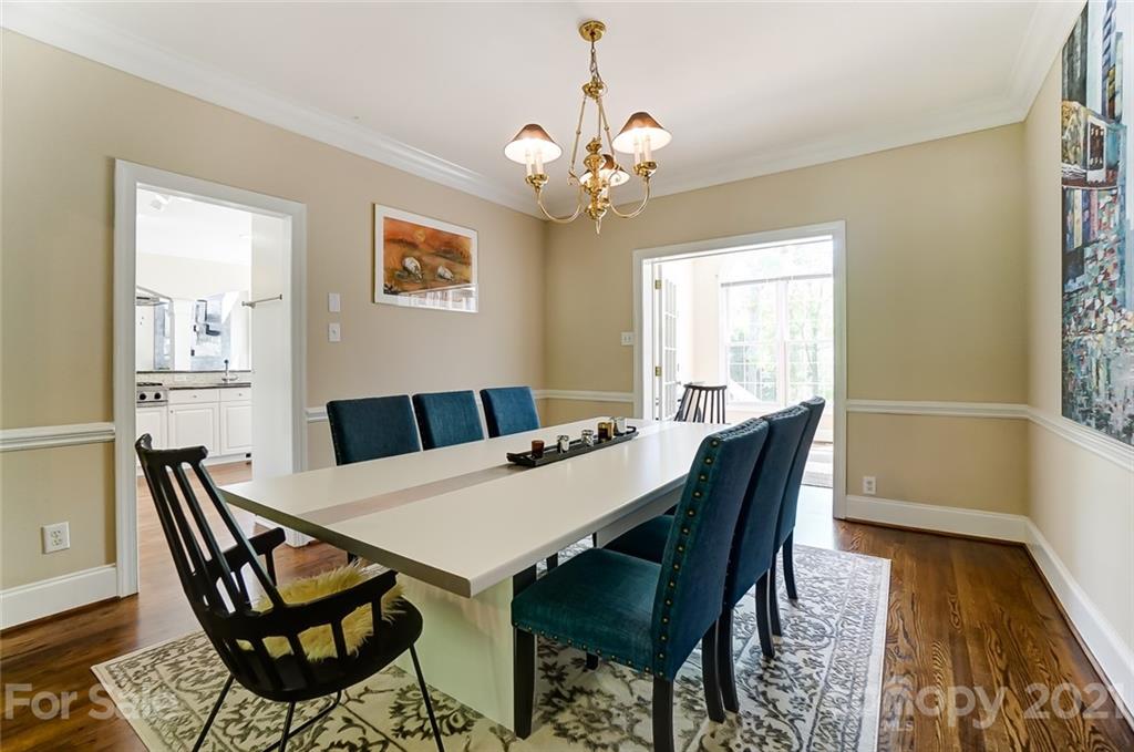 7126 Topsail Circle Tega Cay, SC 29708 - Photo 9 of 48 a view of a dining room with furniture and wooden floor