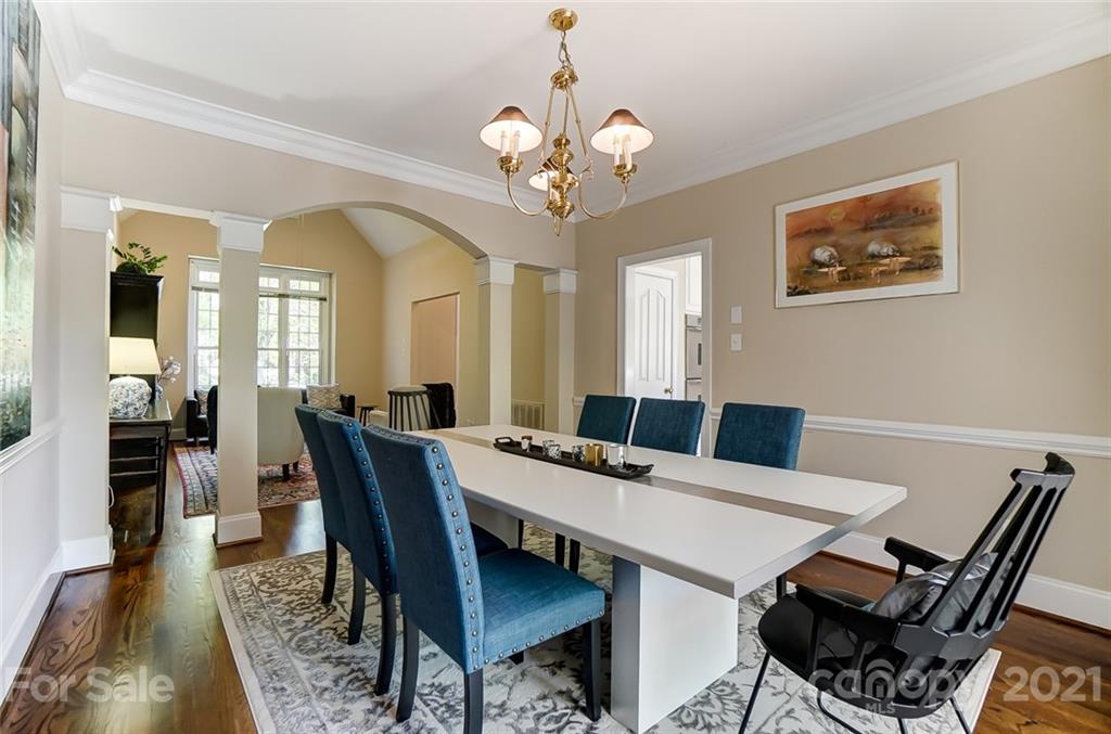 7126 Topsail Circle Tega Cay, SC 29708 - Photo 10 of 48 a view of a dining room with furniture and wooden floor