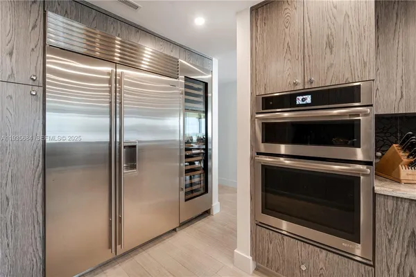 a kitchen with a stove and a refrigerator