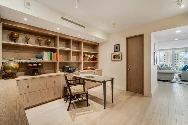 a workspace with furniture and wooden floor