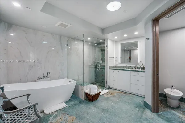 a bathroom with a bathtub sink and toilet