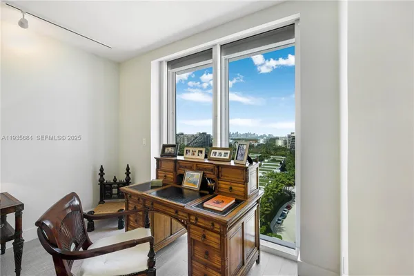 a view of a livingroom with furniture and window