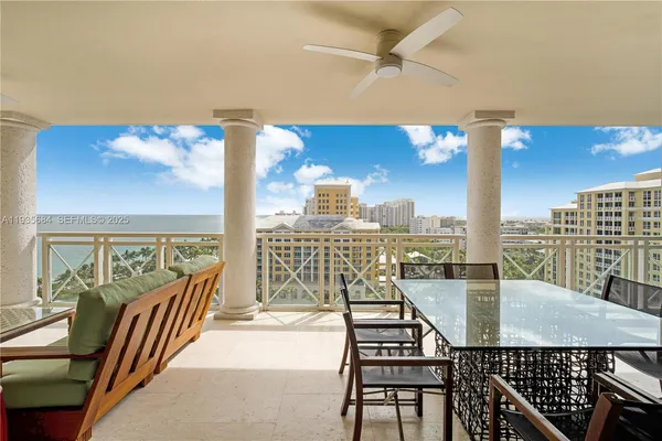 a view of a balcony with furniture