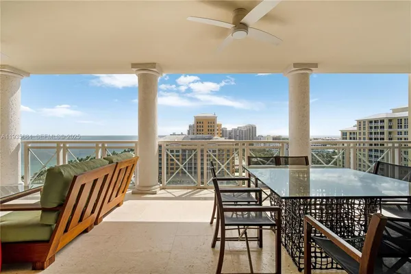 a view of a balcony with chairs