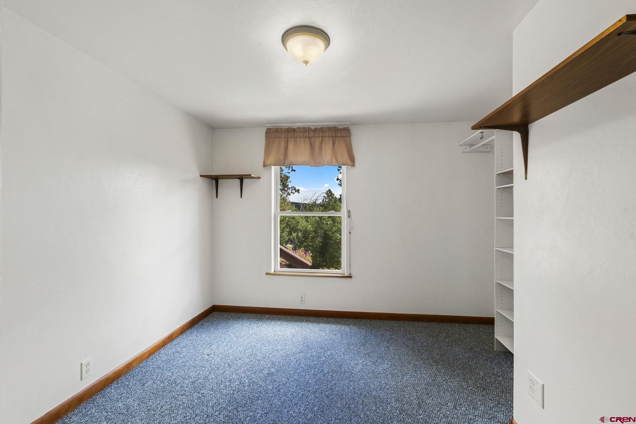 564 Spring Road Durango, CO 81303 - Photo 12 of 45 an empty room with a window