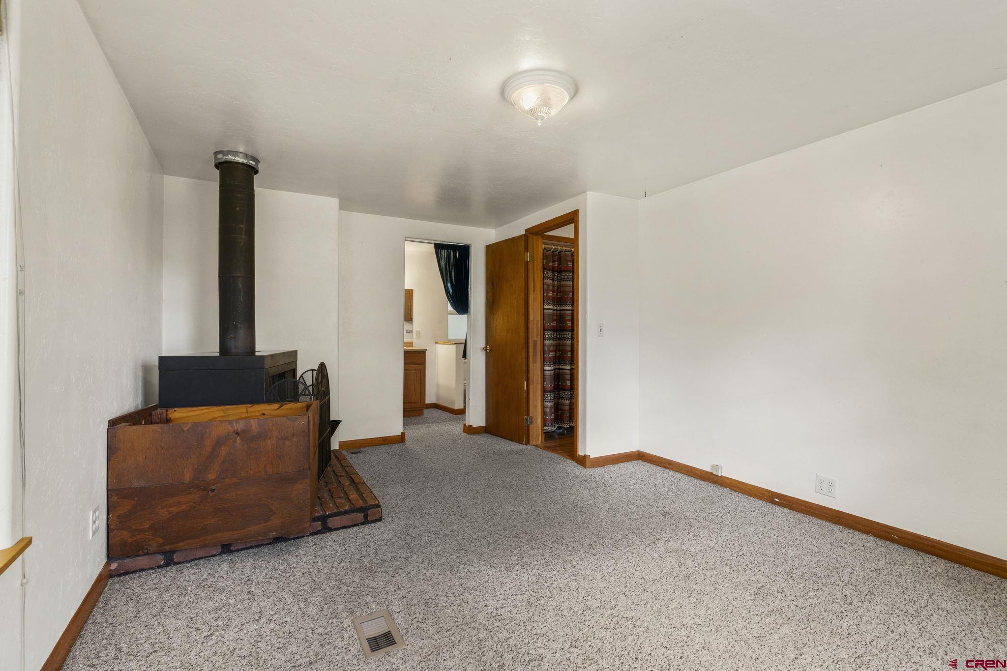 564 Spring Road Durango, CO 81303 - Photo 15 of 45 a living room with furniture and a flat screen tv