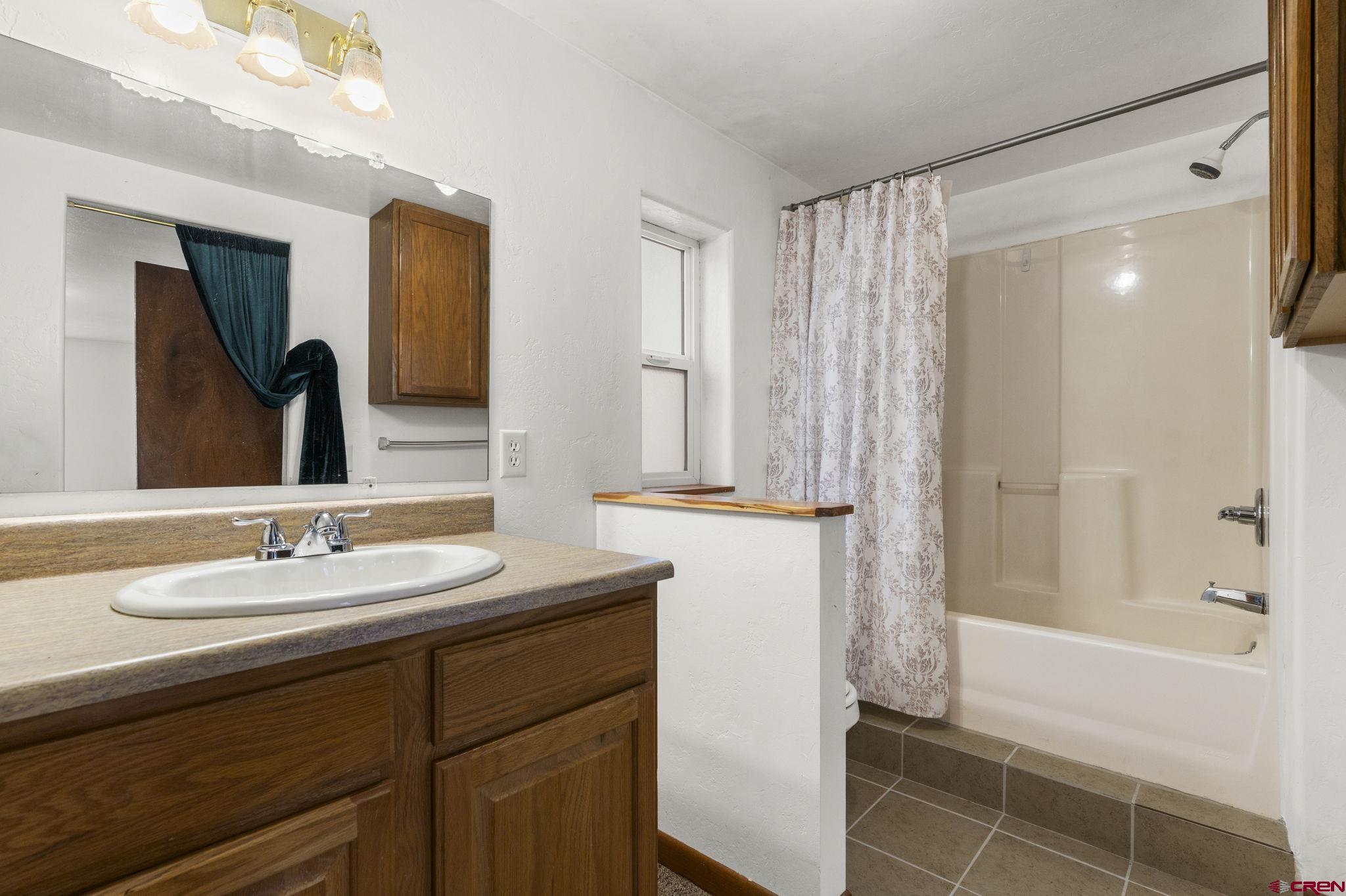 564 Spring Road Durango, CO 81303 - Photo 16 of 45 a bathroom with a sink and a mirror