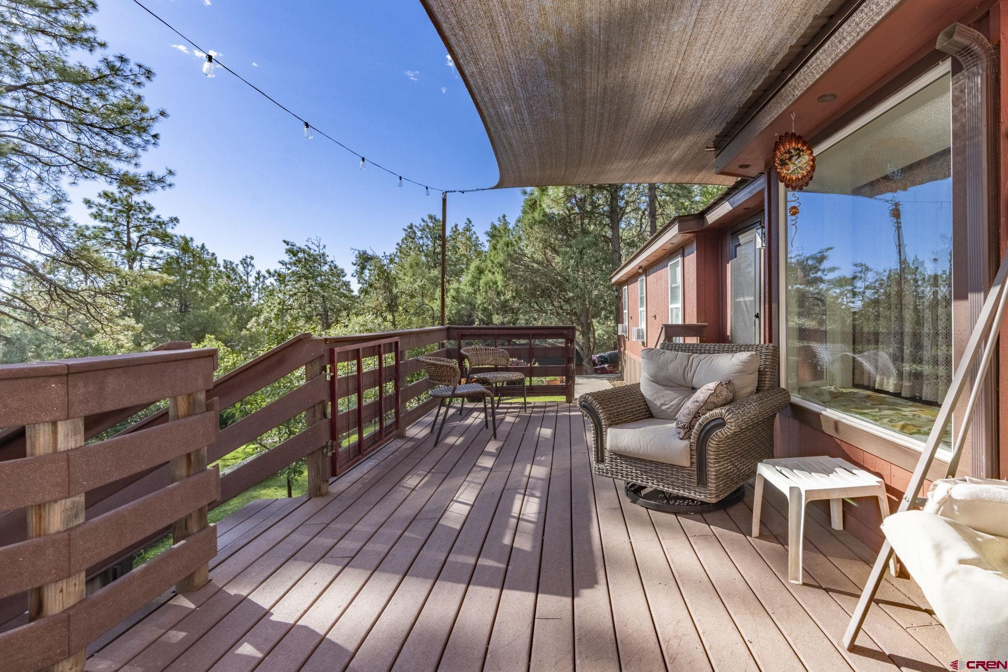 564 Spring Road Durango, CO 81303 - Photo 27 of 45 a view of balcony with wooden floor and outdoor seating
