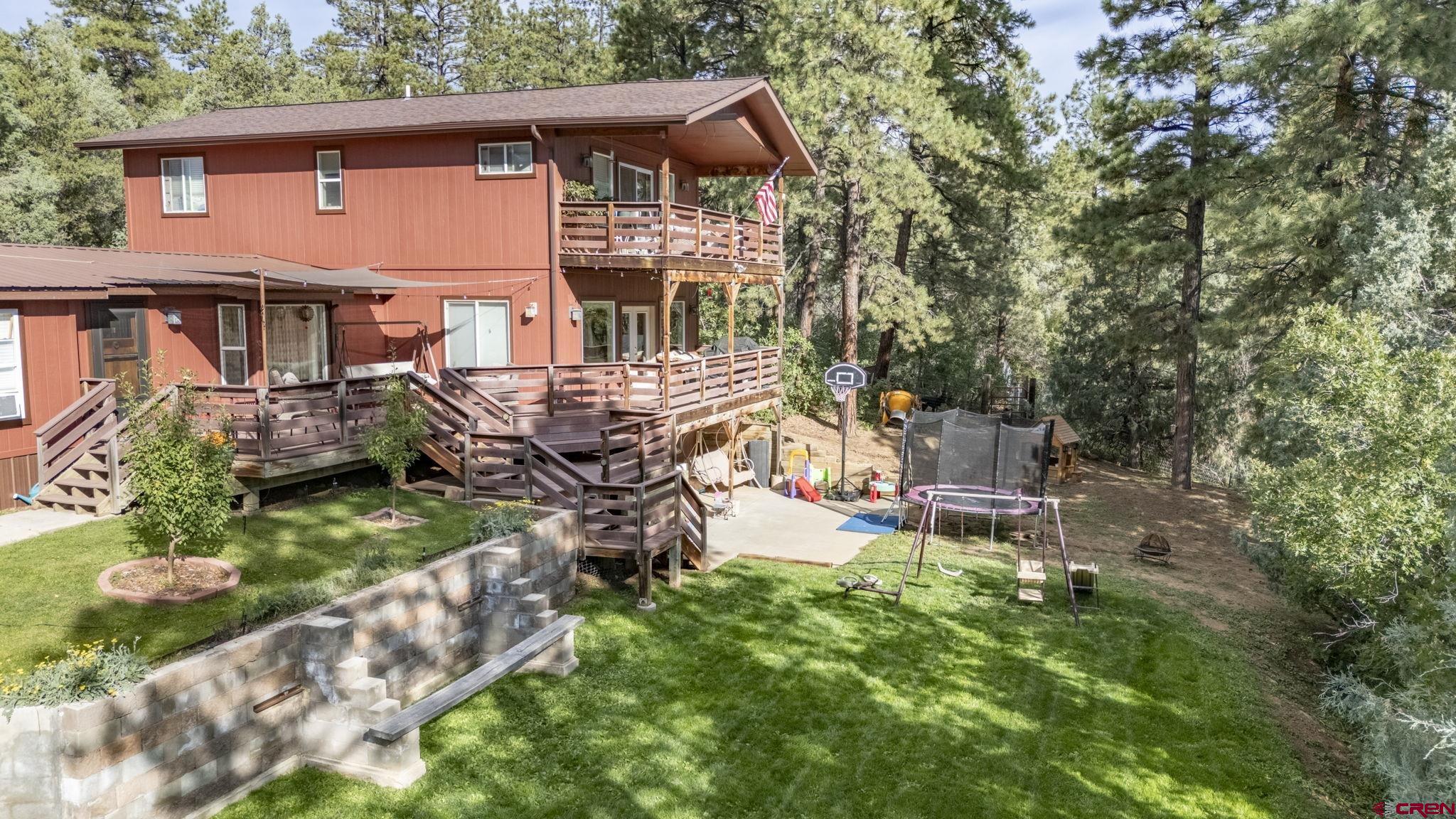 564 Spring Road Durango, CO 81303 - Photo 28 of 45 an aerial view of a house with swimming pool and sitting area