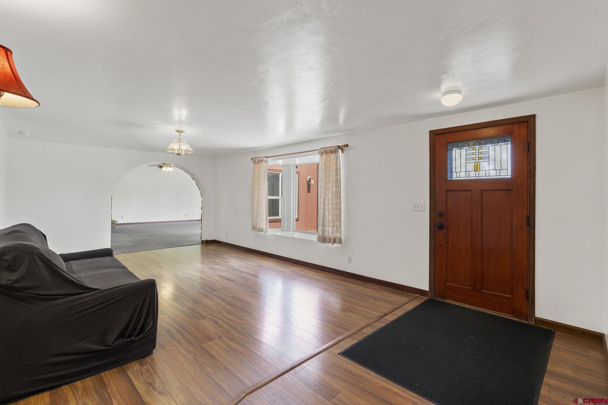 564 Spring Road Durango, CO 81303 - Photo 3 of 45 a view of a livingroom with furniture and wooden floor
