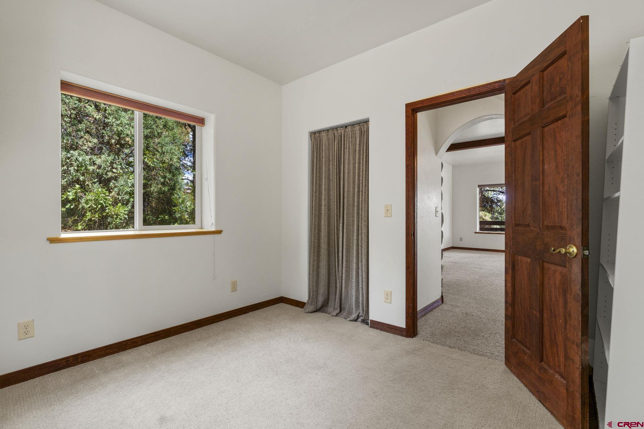 564 Spring Road Durango, CO 81303 - Photo 32 of 45 an empty room that has a window and closet