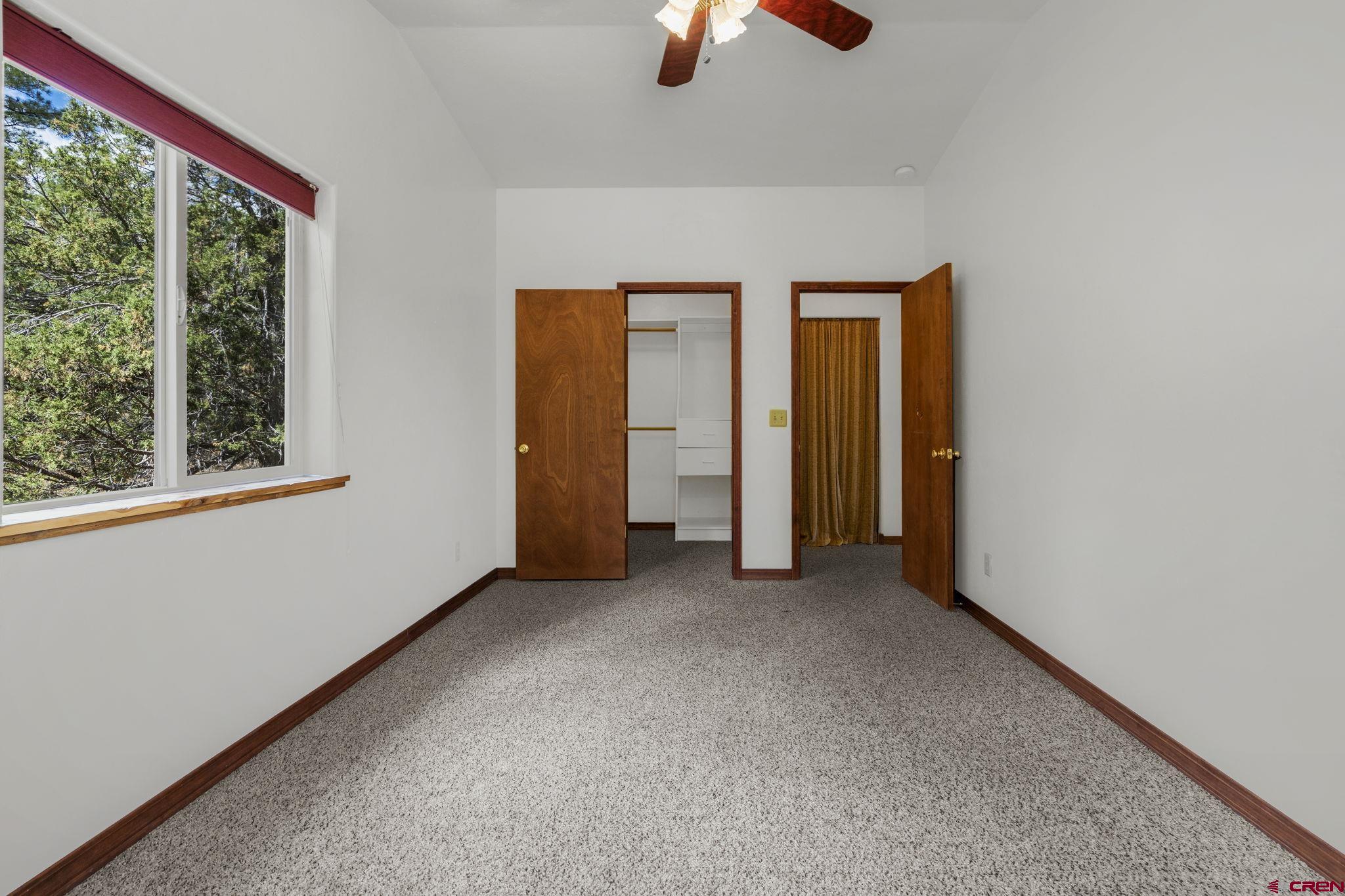 564 Spring Road Durango, CO 81303 - Photo 38 of 45 an empty room with window and closet