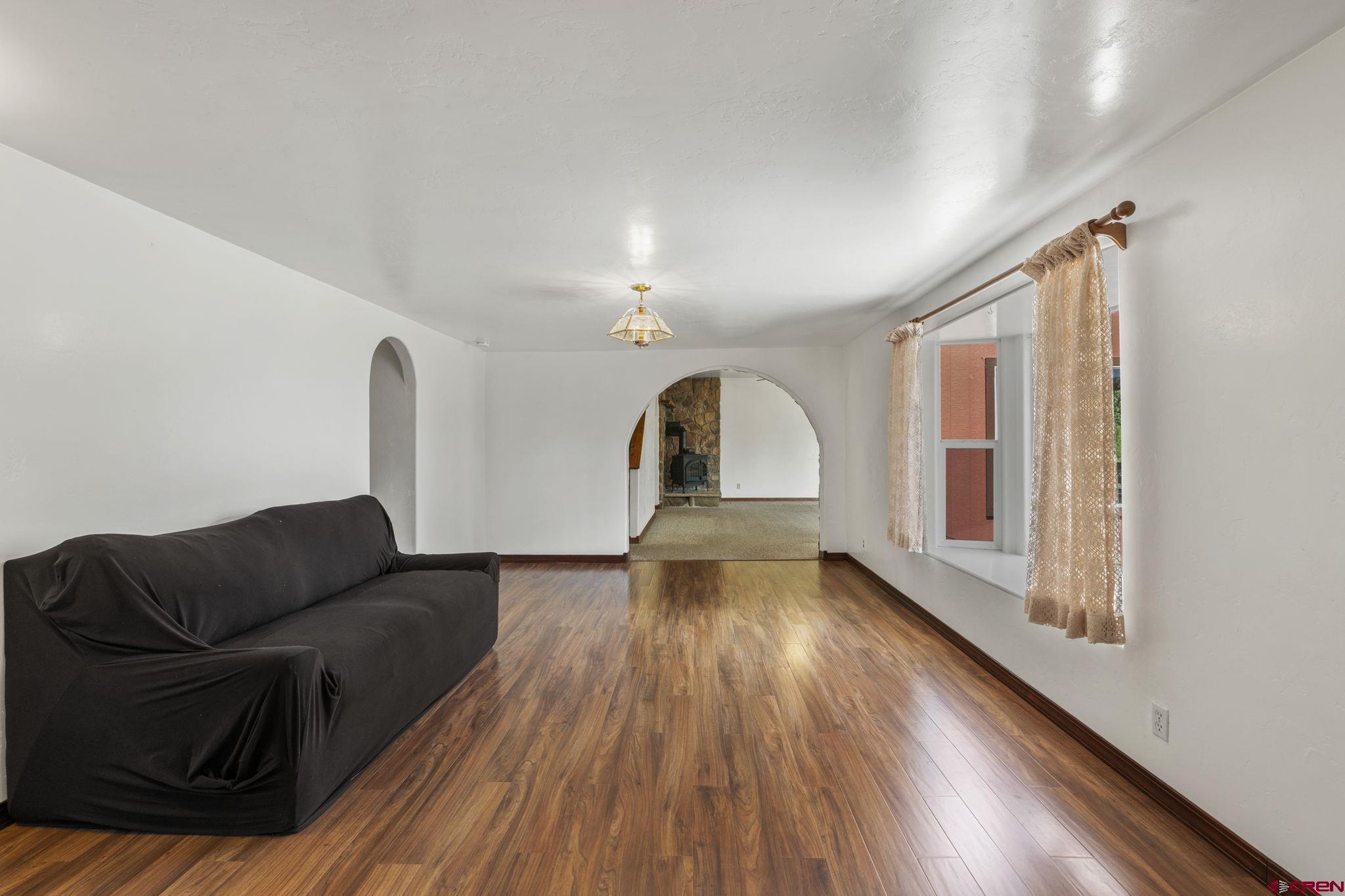564 Spring Road Durango, CO 81303 - Photo 4 of 45 a living room with furniture and a wooden floor