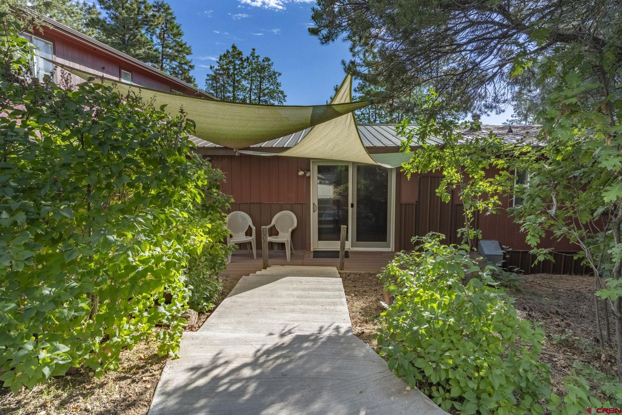564 Spring Road Durango, CO 81303 - Photo 42 of 45 a front view of a house with garden