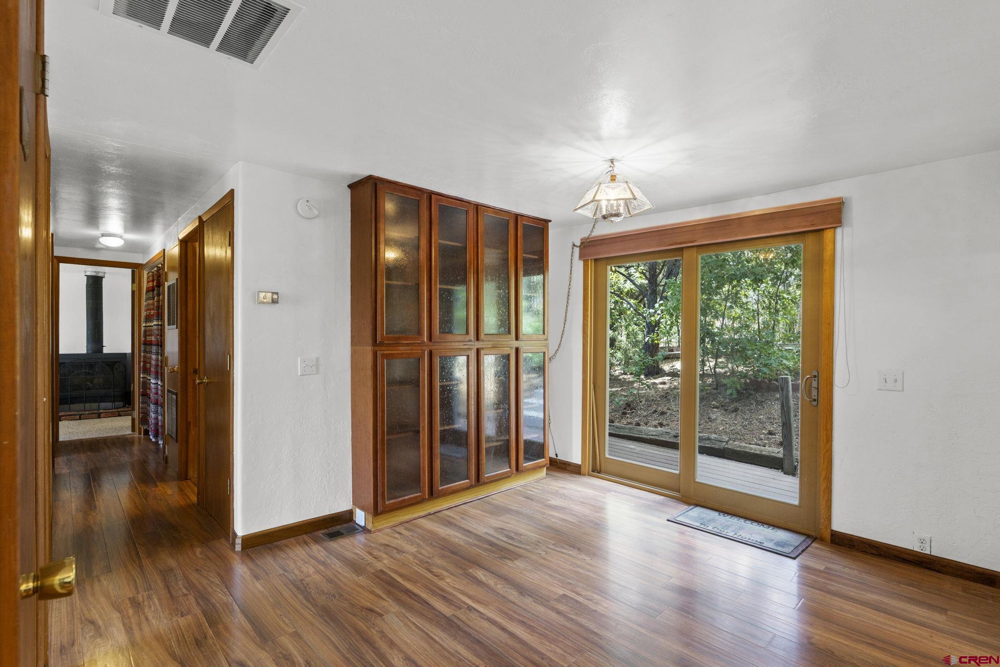 564 Spring Road Durango, CO 81303 - Photo 6 of 45 a view of empty room with wooden floor and fan