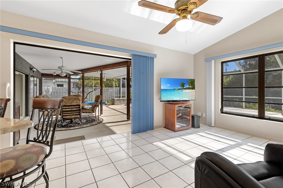 17501 Laurel Valley Road Fort Myers, FL 33967 - Photo 16 of 26 a bed room with a bed and a chair