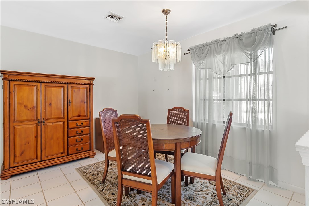 17501 Laurel Valley Road Fort Myers, FL 33967 - Photo 2 of 26 a view of a dining room with furniture window and outside view