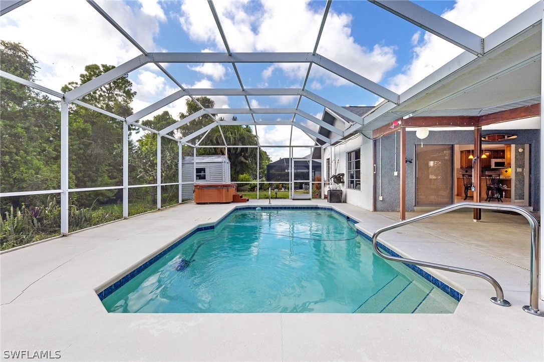 17501 Laurel Valley Road Fort Myers, FL 33967 - Photo 24 of 26 a view of a swimming pool with a porch