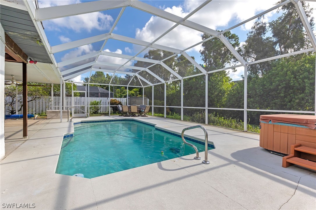 17501 Laurel Valley Road Fort Myers, FL 33967 - Photo 25 of 26 a view of a chair and tables in the patio