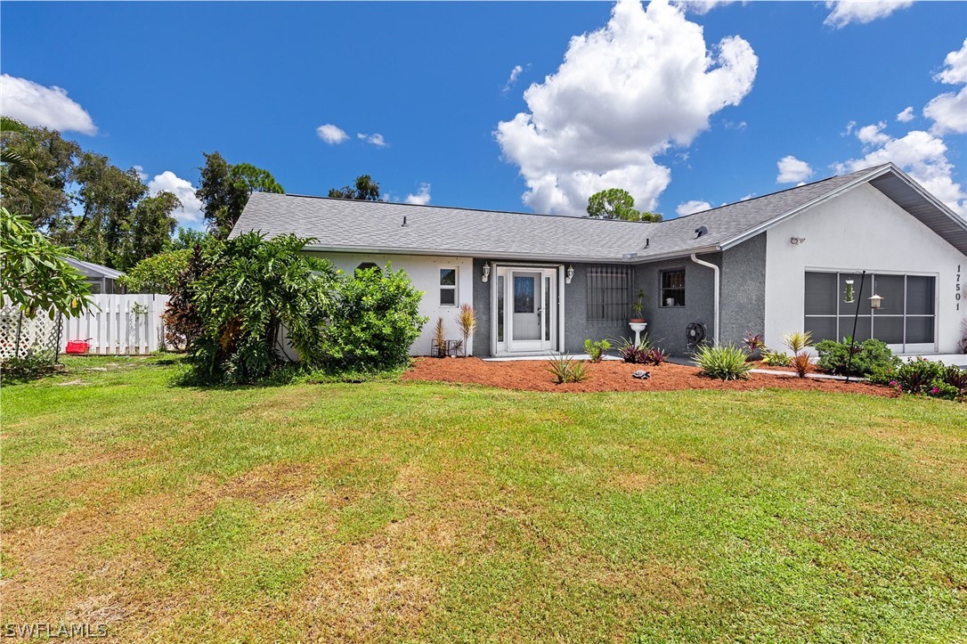 17501 Laurel Valley Road Fort Myers, FL 33967 - Photo 26 of 26 a view of a house with backyard and a garden