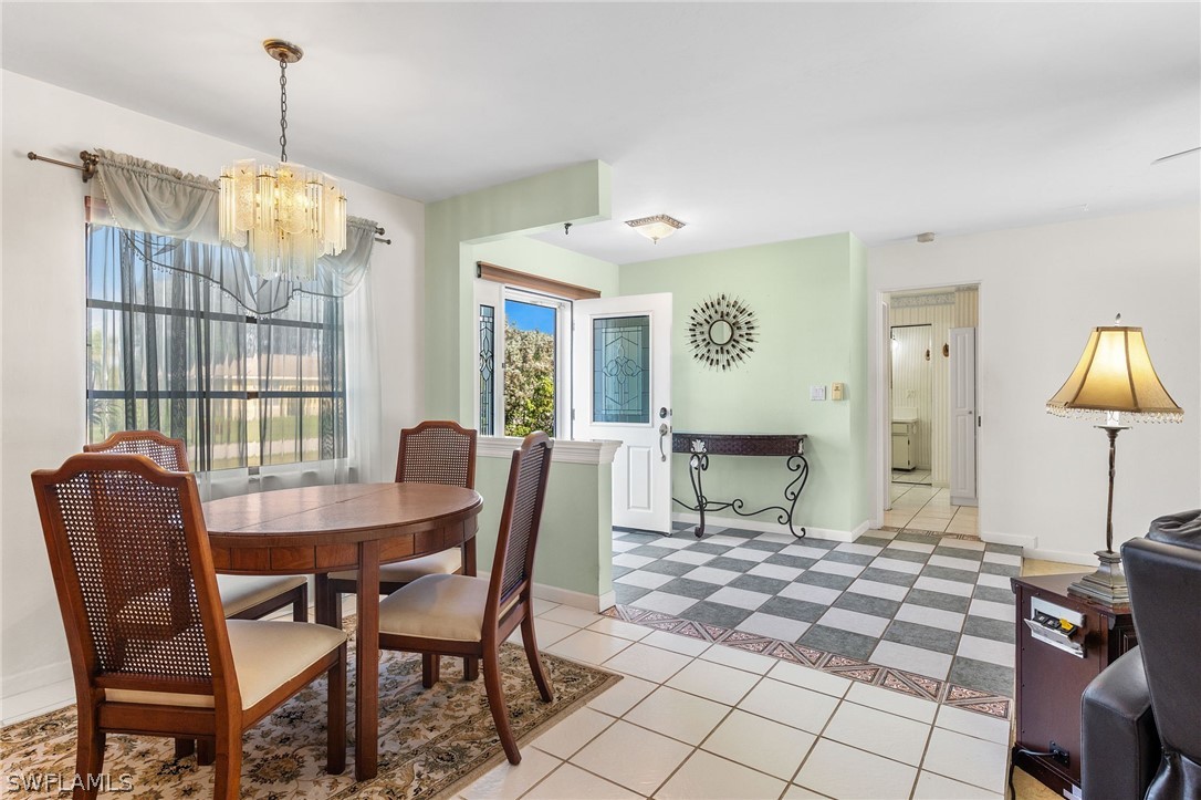 17501 Laurel Valley Road Fort Myers, FL 33967 - Photo 3 of 26 a dining room with furniture and window