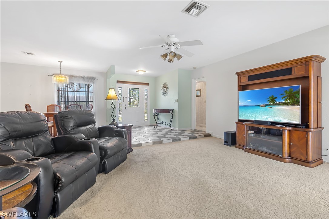 17501 Laurel Valley Road Fort Myers, FL 33967 - Photo 4 of 26 a living room with furniture and a flat screen tv