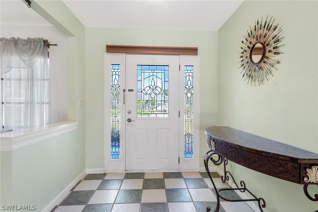 17501 Laurel Valley Road Fort Myers, FL 33967 - Photo 6 of 26 a view of a door and chair in a room