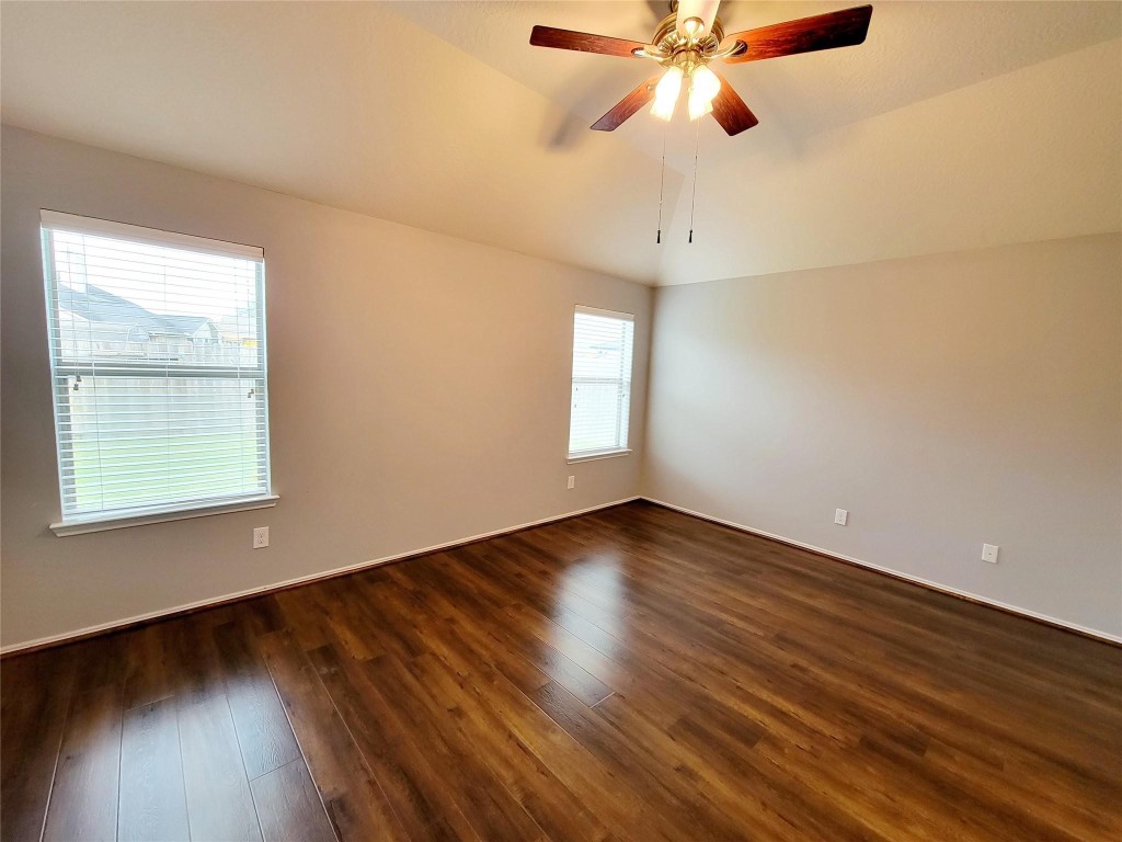 219 Golden Grain Drive Rosenberg, TX 77469 - Photo 13 of 17 wooden floor in an empty room with a window