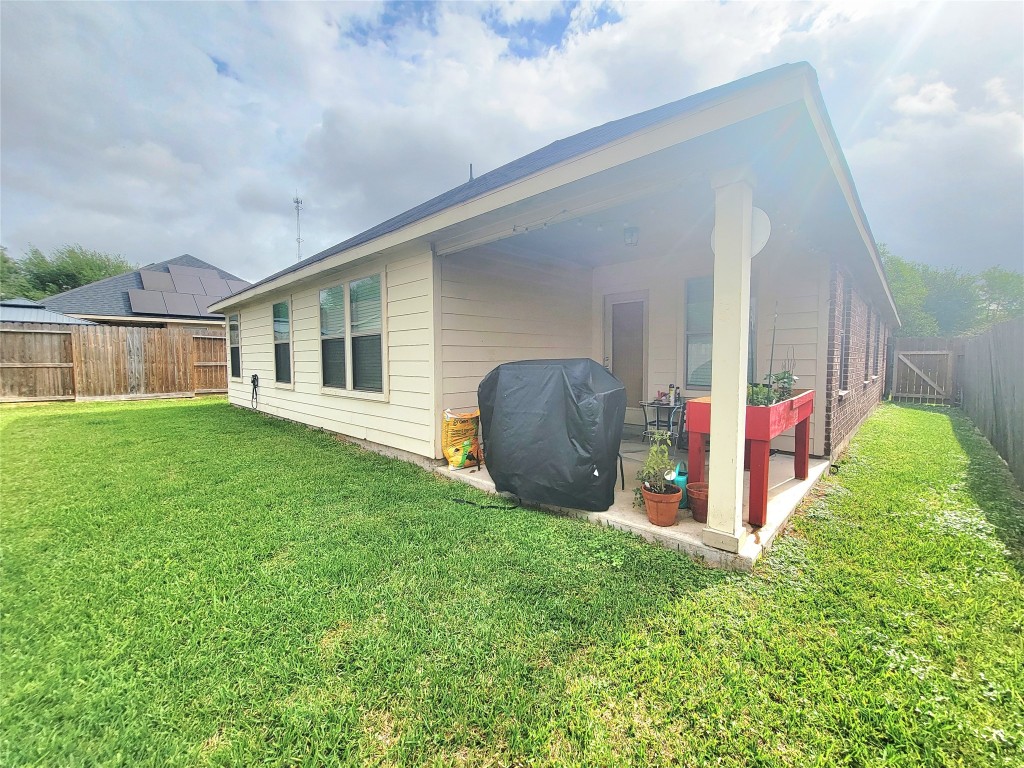 219 Golden Grain Drive Rosenberg, TX 77469 - Photo 17 of 17 a view of backyard with a garden and plants