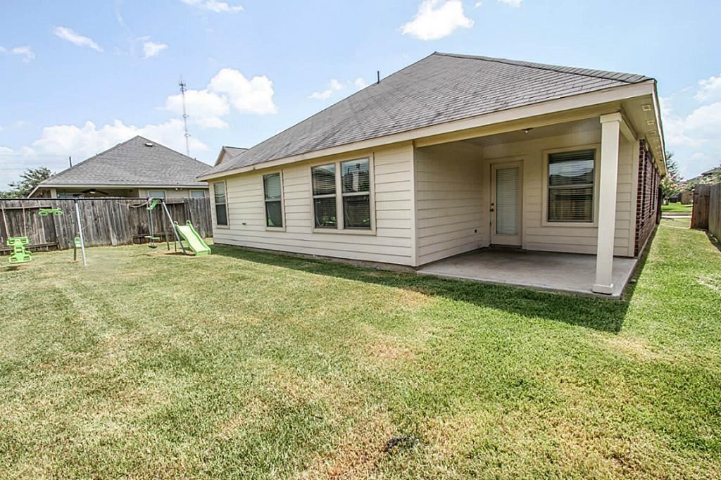 219 Golden Grain Drive Rosenberg, TX 77469 - Photo 2 of 17 a front view of house with yard